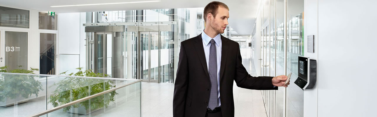 A man scanning his ID card at the office