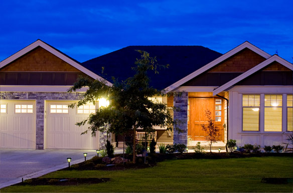 lights turned on at a house with slanting roof